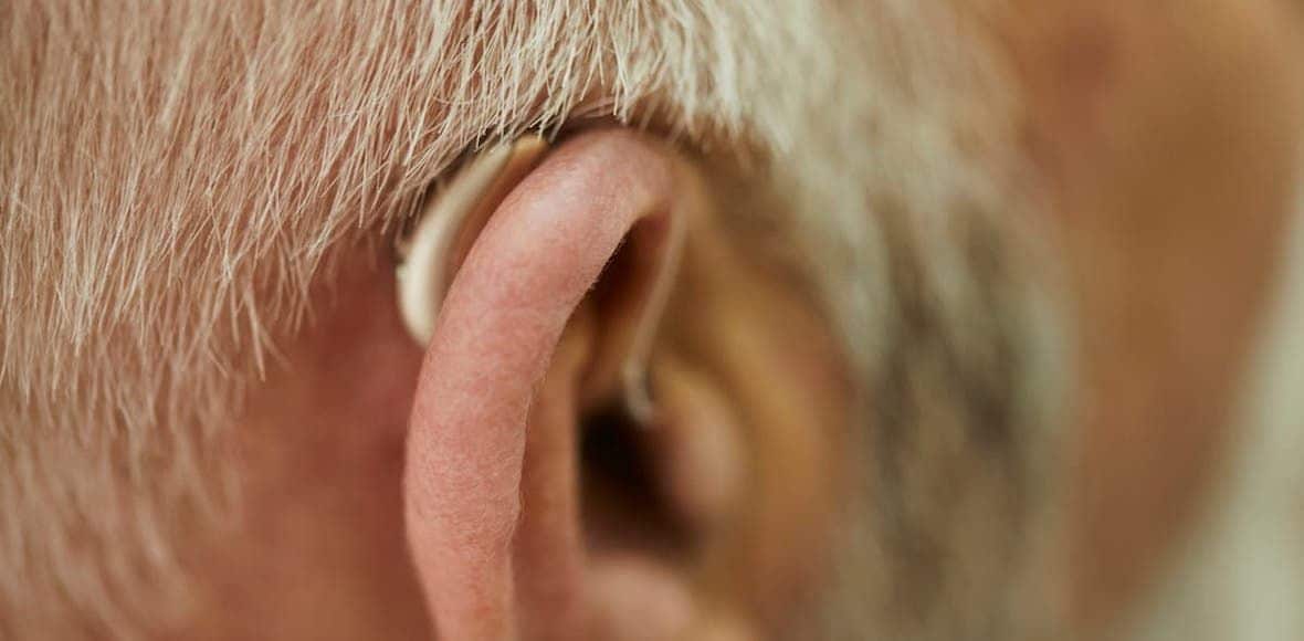close up of senior man with hearing aid 1180x580 11 04 32 449399